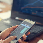 Businessman using mobile smartphone with data information bankin